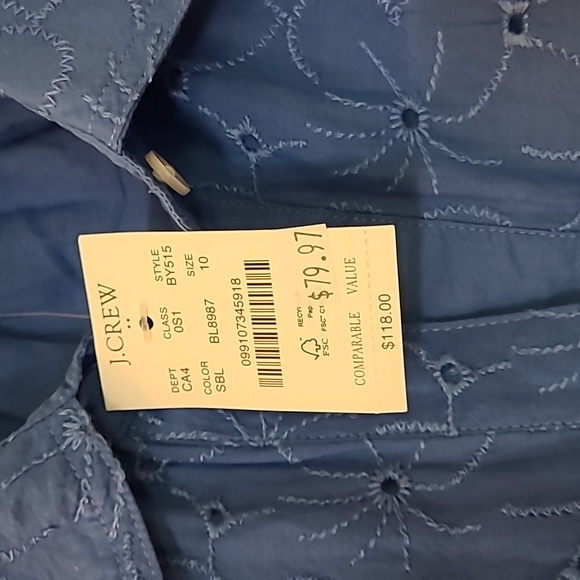 A sky blue eyelet dress with a button down front. Long sleeve with button cuffs. - Picture 2 of 4